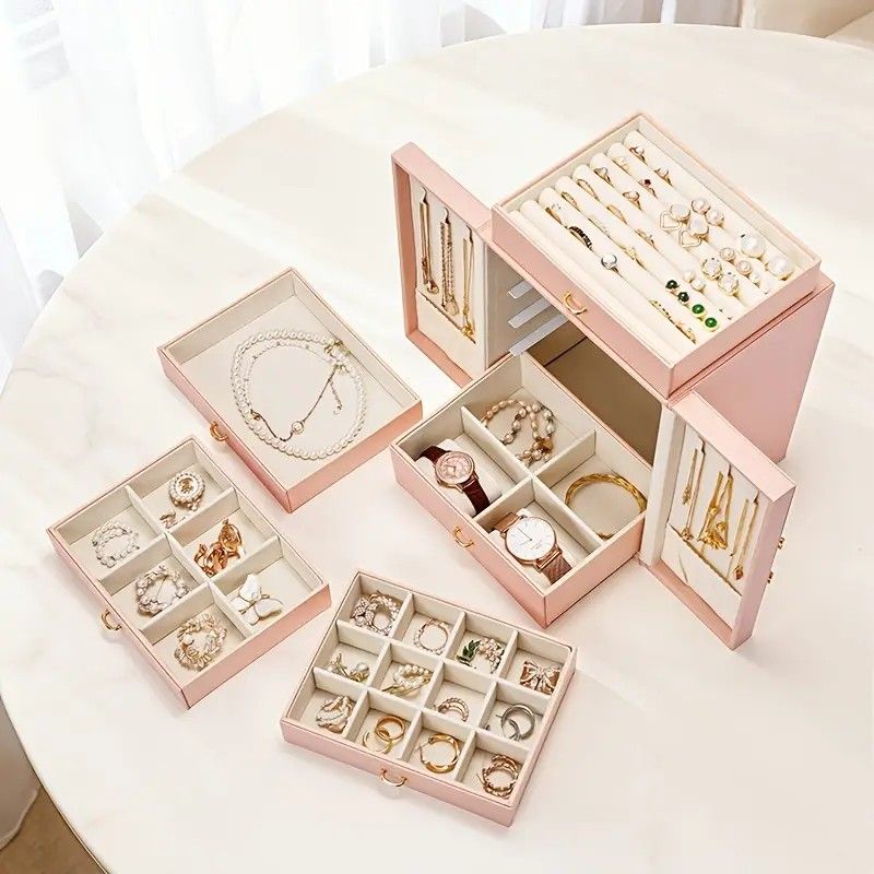 Pink 1 Large Faux Leather Jewelry Storage Box with 5 Drawers and Gold Handles - An elegant rectangular storage space for rings, necklaces, bracelets, earrings, and watches - Features soft fabric lining, side door design, textured surface finish - Luxury