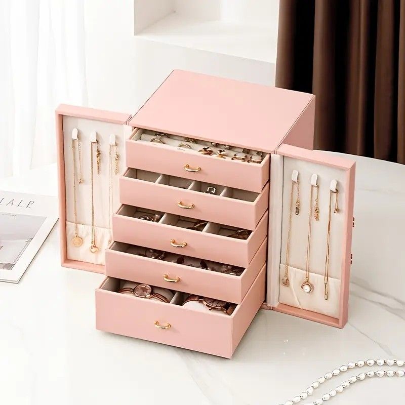 Pink 1 Large Faux Leather Jewelry Storage Box with 5 Drawers and Gold Handles - An elegant rectangular storage space for rings, necklaces, bracelets, earrings, and watches - Features soft fabric lining, side door design, textured surface finish - Luxury