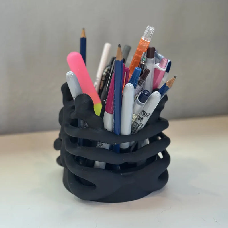 3D Printed Rib Pen Holder - Skeleton Desktop Organizer is both a practical pen holder and a sculpture.
