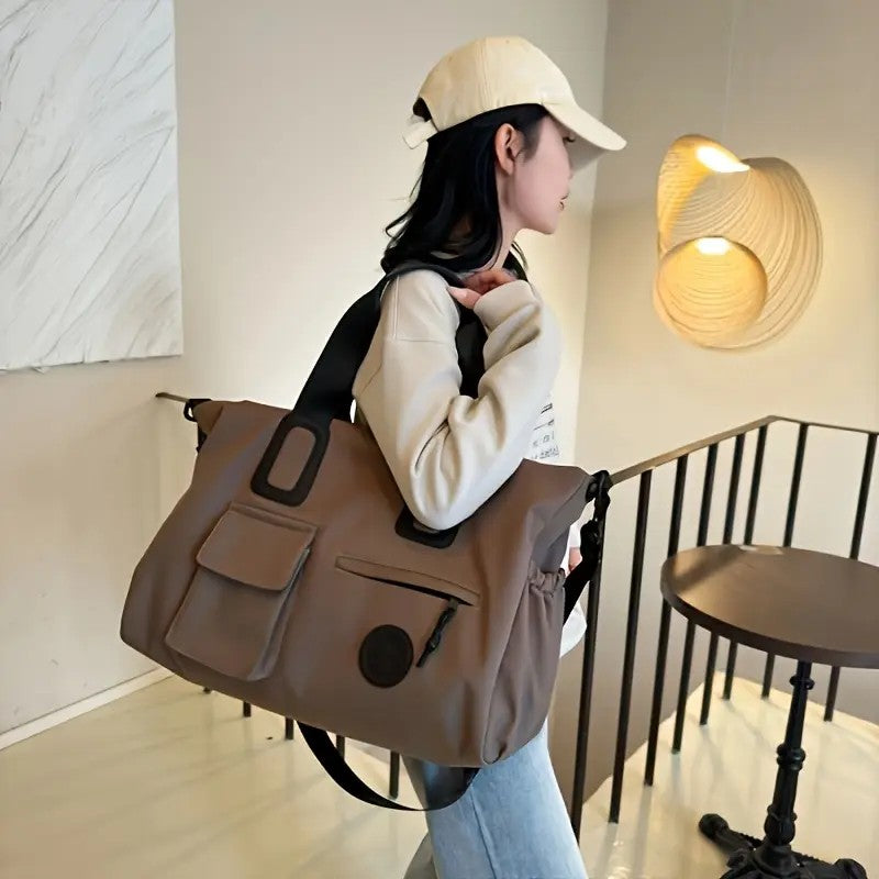 brown Large-capacity travel tote bag, lightweight carry-on luggage with shoulder strap, gym bag, portable laptop bag, ideal for short trips, hand-carry style.