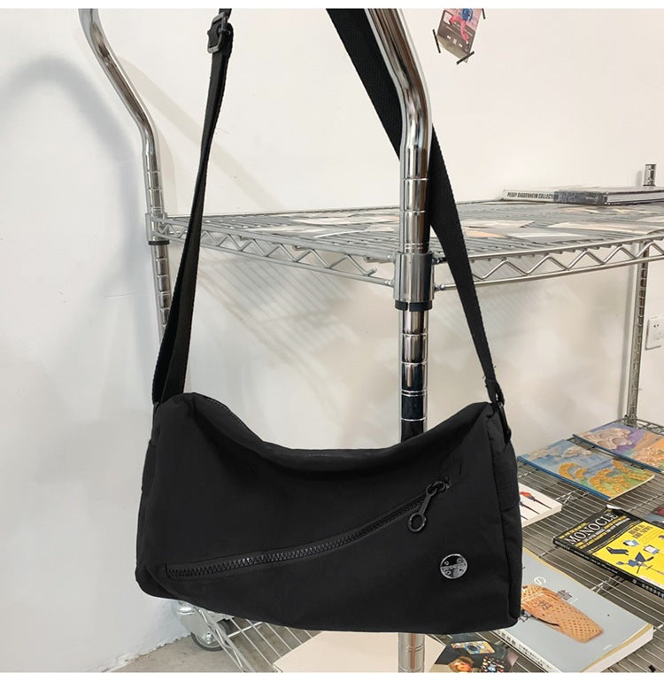 An elegant black shoulder bag for travel and work
