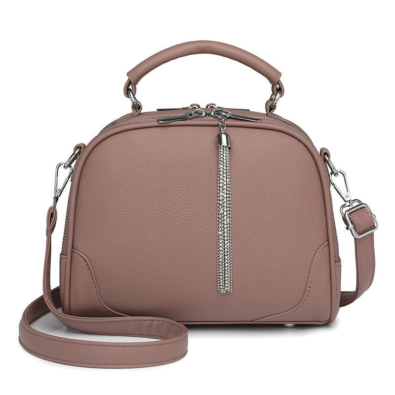 Cinnamon Chic Mini Round Crossbody Bag for Women - Elegant Handbag with Tassel Accent