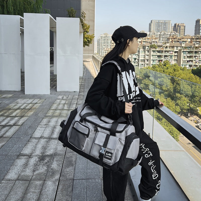 Grey Unisex Travel Bag with Utility Buckles and Wet/Dry Compartments